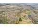 Aerial view of a wooded property with a winding driveway leading to a house at 679 Bo Bo Banks Rd, Grantville, GA 30220