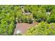 Aerial view of property with a house, pond, and lush green forest at 679 Bo Bo Banks Rd, Grantville, GA 30220