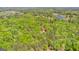 Stunning aerial perspective of extensive, wooded landscape featuring multiple lakes, highlighting natural splendor at 679 Bo Bo Banks Rd, Grantville, GA 30220