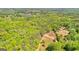 Beautiful aerial shot of sprawling, wooded acreage with a pristine lake, offering a serene escape at 679 Bo Bo Banks Rd, Grantville, GA 30220