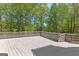 A large back deck and railing is ideal for outside dining or entertaining at 679 Bo Bo Banks Rd, Grantville, GA 30220