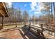 View of a calm lake with a wooden deck and bench seating at 679 Bo Bo Banks Rd, Grantville, GA 30220
