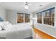 Bedroom featuring large windows with natural light, hardwood floors, and neutral wall colors at 679 Bo Bo Banks Rd, Grantville, GA 30220