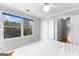 Bedroom showcasing a large window with natural light, a ceiling fan, and an open door to hallway at 679 Bo Bo Banks Rd, Grantville, GA 30220