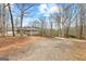 Wide driveway leads to a charming home with trees and bushes surrounding the property at 679 Bo Bo Banks Rd, Grantville, GA 30220