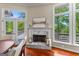 Dining area featuring a fireplace and scenic views at 679 Bo Bo Banks Rd, Grantville, GA 30220