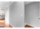 Bright hallway leads to a living room with hardwood floors, and provides access to the stairway at 679 Bo Bo Banks Rd, Grantville, GA 30220