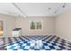 Charming kitchen featuring blue checkered flooring, and a view of outside from the window at 679 Bo Bo Banks Rd, Grantville, GA 30220
