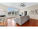 Bright living room featuring hardwood floors, a fireplace, and large windows with scenic views at 679 Bo Bo Banks Rd, Grantville, GA 30220