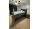 Bedroom with queen bed, ceiling fan, dark curtains and nightstand at 223 Rivers Rd, Fayetteville, GA 30214
