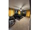 Bedroom setup as office, with black queen bed and yellow curtains at 223 Rivers Rd, Fayetteville, GA 30214
