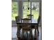 Cozy dining area with rustic table, seating for six, and bright natural light at 223 Rivers Rd, Fayetteville, GA 30214