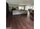 Spacious living room with fireplace, built-in shelving, hardwood floors, and access to patio at 223 Rivers Rd, Fayetteville, GA 30214