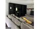 Living room showcasing custom built-in shelving, fireplace, and plush sectional sofa at 223 Rivers Rd, Fayetteville, GA 30214