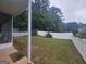 Lush backyard with white picket fence providing privacy and charm for outdoor enjoyment at 320 Weatherly Drive, Fayetteville, GA 30214