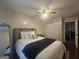 Inviting bedroom with plush bedding, hardwood floors, and a bright, airy atmosphere at 320 Weatherly Drive, Fayetteville, GA 30214