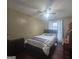 Bedroom features include ceiling fan, dark wood floors, natural light, and neutral color palette at 320 Weatherly Drive, Fayetteville, GA 30214