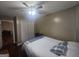 Bedroom features a closet, neutral color palette, and modern ceiling fan and light fixture at 320 Weatherly Drive, Fayetteville, GA 30214