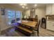 Charming dining space featuring rustic wooden table set and natural light from the window at 320 Weatherly Drive, Fayetteville, GA 30214