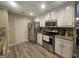 Modern kitchen featuring stainless steel appliances, granite countertops, and plenty of storage at 320 Weatherly Drive, Fayetteville, GA 30214