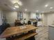 Open dining area flowing into a well-equipped kitchen with stainless steel appliances and granite counters at 320 Weatherly Drive, Fayetteville, GA 30214