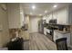 Well-lit kitchen with stainless steel appliances, granite countertops, and sleek flooring at 320 Weatherly Drive, Fayetteville, GA 30214