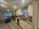 Well-lit kitchen featuring granite countertops, stainless steel appliances and a cozy dining area at 320 Weatherly Drive, Fayetteville, GA 30214
