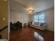 Cozy living room features hardwood floors, a ceiling fan, and a comfortable couch with stylish throw pillows at 320 Weatherly Drive, Fayetteville, GA 30214