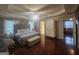 Main Bedroom features a trey ceiling, hardwood floors, plenty of natural light, and designer decor at 320 Weatherly Drive, Fayetteville, GA 30214
