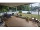 Enclosed patio with tiled floor and a clear view of the fenced-in backyard, perfect for outdoor dining at 320 Weatherly Drive, Fayetteville, GA 30214