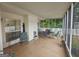 Enclosed patio features tiled floor, offering a comfortable area for relaxation or entertaining with views of the yard at 320 Weatherly Drive, Fayetteville, GA 30214