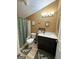 Cozy bathroom with shower and tub, decorative accents, and green floral bath mat at 5894 Par Three Ct, Lithonia, GA 30038