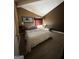 Bedroom featuring a neutral color scheme, cozy decor, and ample natural light from the window at 5894 Par Three Ct, Lithonia, GA 30038