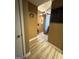 An interior view of a hallway, with wood look flooring, tan walls, and white trim at 5894 Par Three Ct, Lithonia, GA 30038