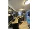 Functional kitchen with stainless steel appliances and a view into the living area at 5894 Par Three Ct, Lithonia, GA 30038