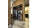 A laundry room setup with modern machines, shelves and adjacent to a bathroom at 5894 Par Three Ct, Lithonia, GA 30038
