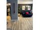 Open-concept living room featuring trendy decor and seamless kitchen access at 5894 Par Three Ct, Lithonia, GA 30038