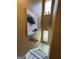 An interior view of a well-lit staircase with tan walls and modern art at 5894 Par Three Ct, Lithonia, GA 30038