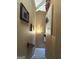 An interior view of a well-lit staircase with tan walls and modern art at 5894 Par Three Ct, Lithonia, GA 30038