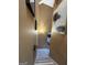 An interior view of a well-lit staircase with tan walls and modern art at 5894 Par Three Ct, Lithonia, GA 30038