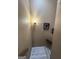 An interior view of a well-lit staircase with tan walls and modern art at 5894 Par Three Ct, Lithonia, GA 30038