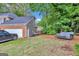 Backyard view with seating, vehicle, and partial view of the house at 4250 Edgewater Nw Ct, Kennesaw, GA 30144