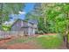Large, level backyard provides ample space for outdoor activities and gardening at 4250 Edgewater Nw Ct, Kennesaw, GA 30144