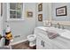 Charming powder room features a modern vanity, stylish mirror, and tasteful decor, creating a welcoming space at 4250 Edgewater Nw Ct, Kennesaw, GA 30144