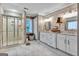 Bright bathroom with a glass-enclosed shower, double vanity, and modern fixtures at 4250 Edgewater Nw Ct, Kennesaw, GA 30144