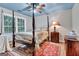 Well-appointed bedroom featuring four-poster bed and bright light at 4250 Edgewater Nw Ct, Kennesaw, GA 30144