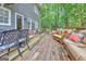 A spacious deck features outdoor seating, perfect for relaxation and entertaining guests at 4250 Edgewater Nw Ct, Kennesaw, GA 30144