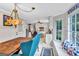 Inviting dining area with a bay window, a wooden table, and a view into the kitchen at 4250 Edgewater Nw Ct, Kennesaw, GA 30144