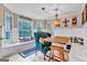 Sunlit dining area featuring a bay window, a comfortable bench, and stylish decor at 4250 Edgewater Nw Ct, Kennesaw, GA 30144