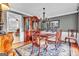 Elegant dining room featuring hardwood floors, sophisticated chandelier, and stylish furnishings and a view to the kitchen at 4250 Edgewater Nw Ct, Kennesaw, GA 30144